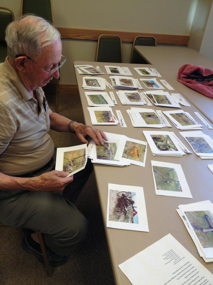Charlie sorting images of farm equipment in the museum's collection, 2013.
