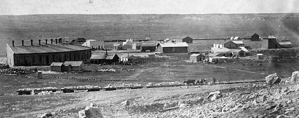 An early image of Sidney shows at left one of the first structures built: a railroad roundhouse.