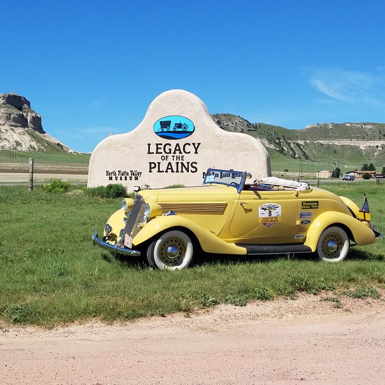 Legacy of the Plains' sponsored car in front of the museum's sign.