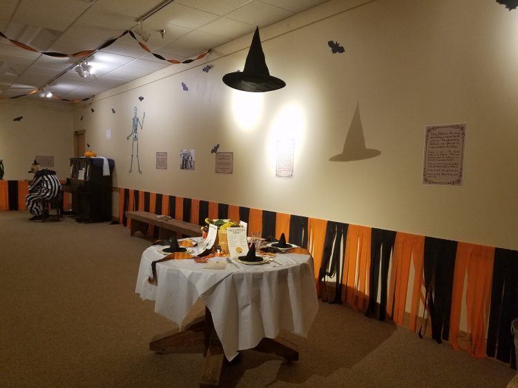 The east wall of the Halloween exhibit. The table shows a typical style of decorating a dinner table for your guests. 