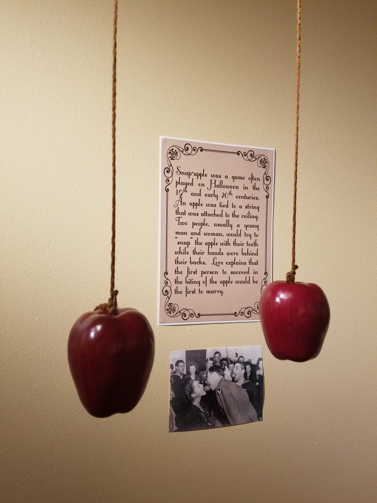 Snap-apple was a popular parlor game aimed towards single young adults. A man and woman would try to bite an apple on a string with their hands tied behind their back!